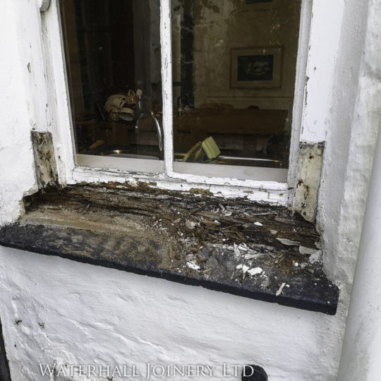 Old rotten window frame in need of repair