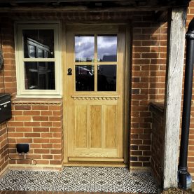 Solid Oak Glazed front door with decorative mantle