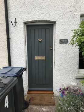Cottage stlye front door with bee knocker