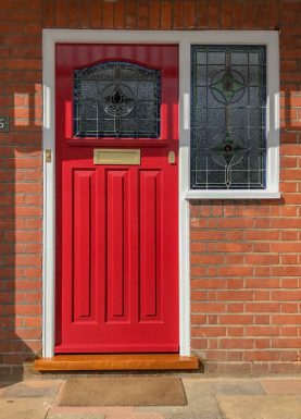 Door and window with coloured leaded glass panels in Baked Cherry by Little Greene