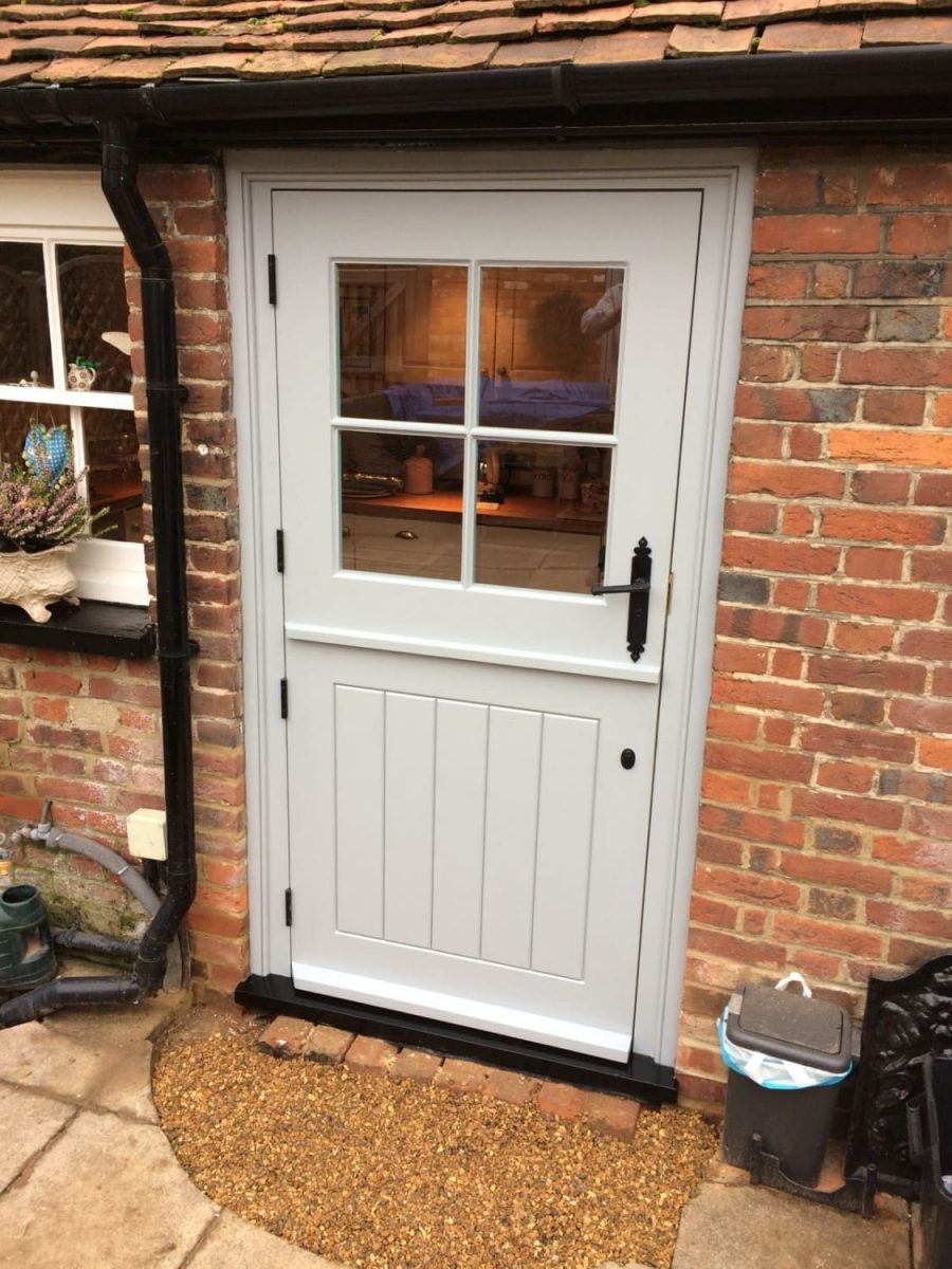 Single Glazed Cottage Stable door with antique black door furniture. Bespoke Joinery