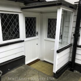 Hardwood back doors with large leaded glazed upper sections